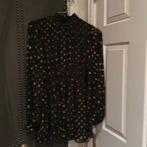 O.P.I. Dress black Lycra with gold shimmer circles. Excellent condition.